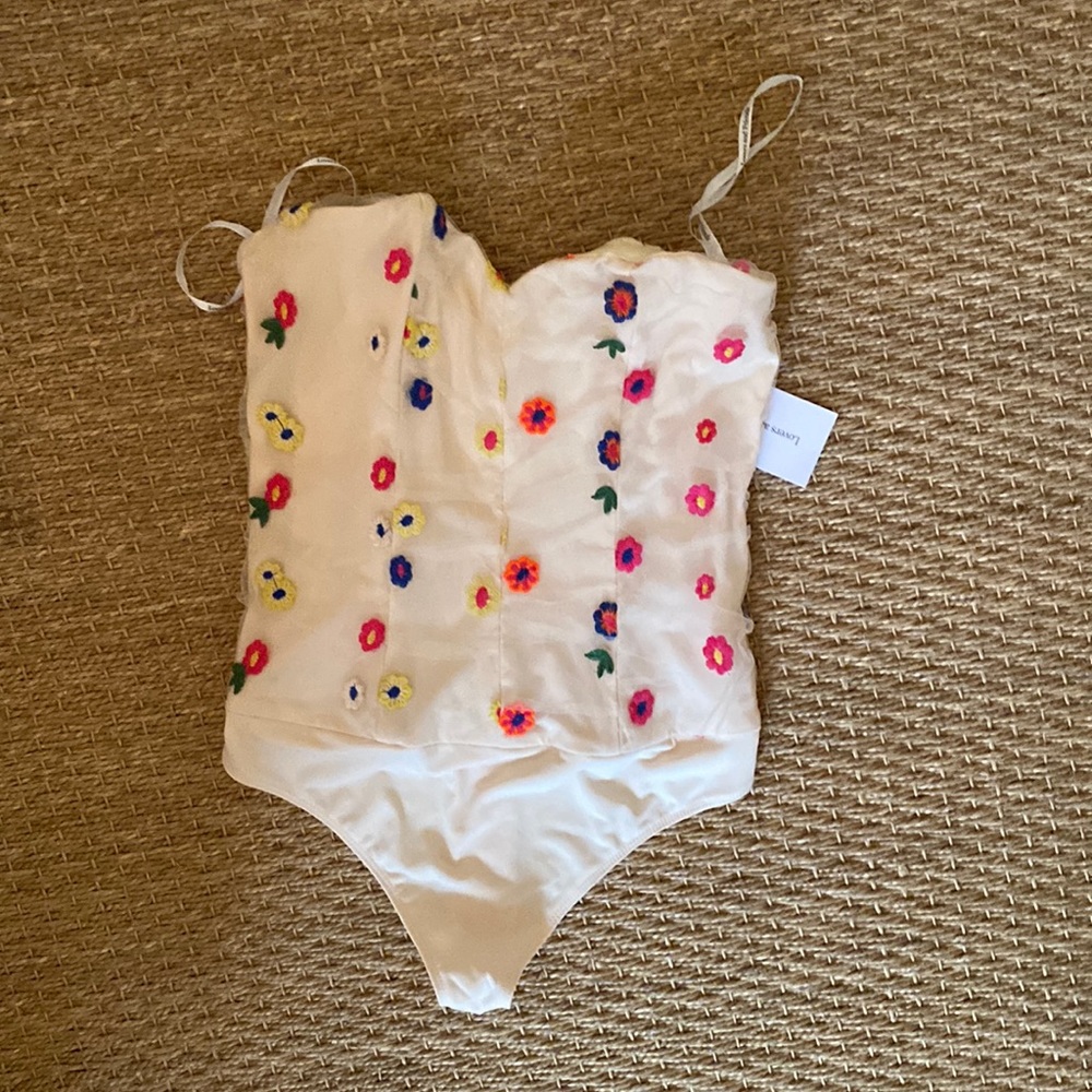 Brand new with tags. Lovers and friends bodysuit. Size small